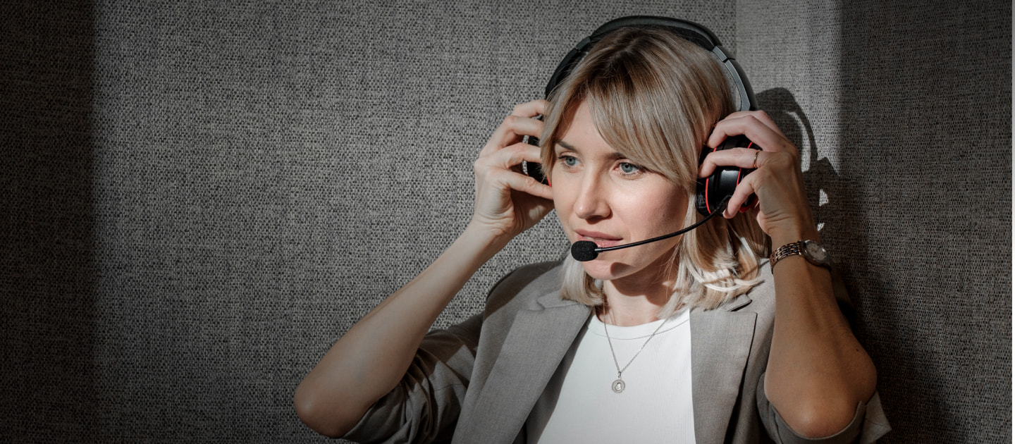 Woman adjusting the Pronounce headset on her head