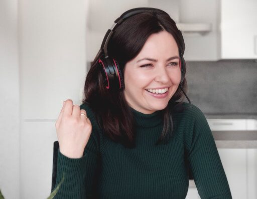 Woman with a Pronounce headset laughing
